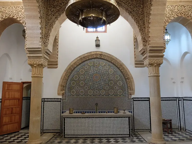 Zellige-tiled interior of the historic Saffarin hammam in Fes