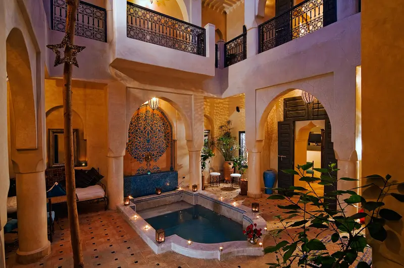 Candlelit courtyard with a plunge pool in a traditional Marrakech riad