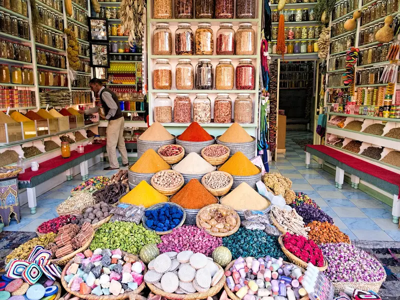 Pyramids of colorful spices at a spice shop in a Moroccan souk
