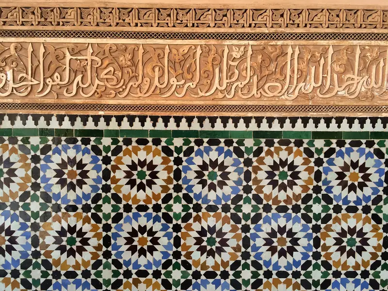 Detail of zellige mosaic tilework at the Ben Youssef Madrasa